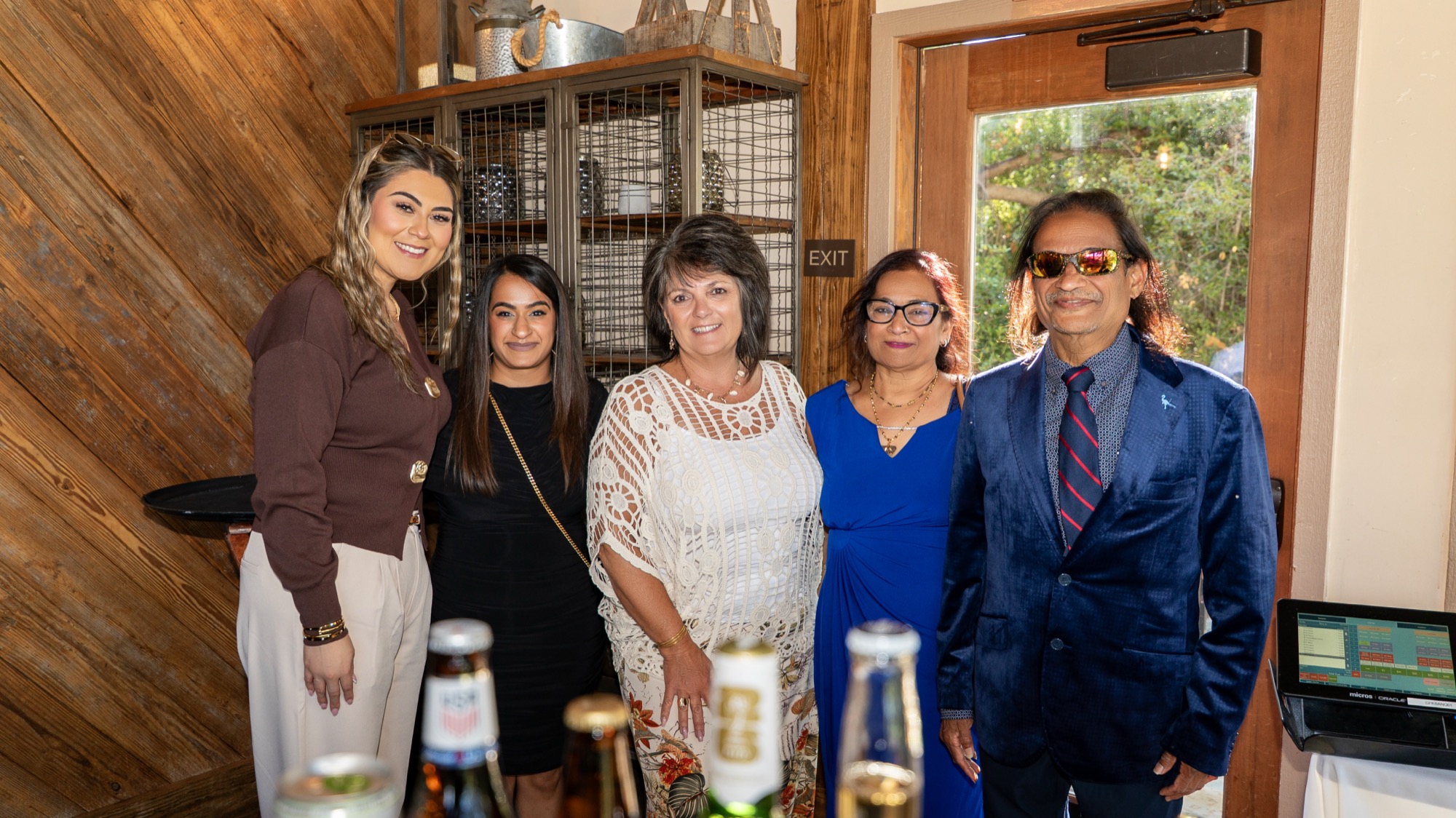 Group of women and Dr. Amin's father celebrating together