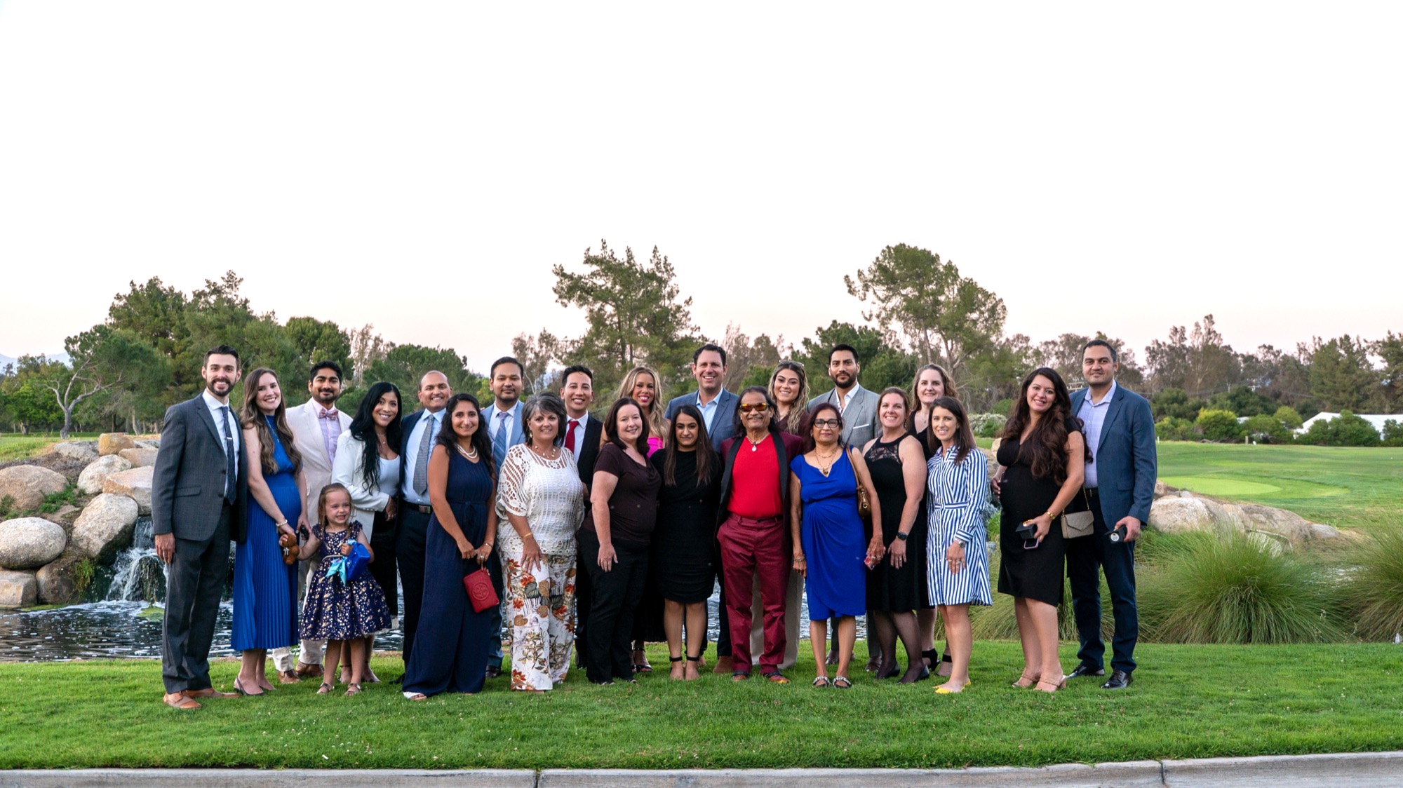 Large group photo of physicians, families, and guests outdoors