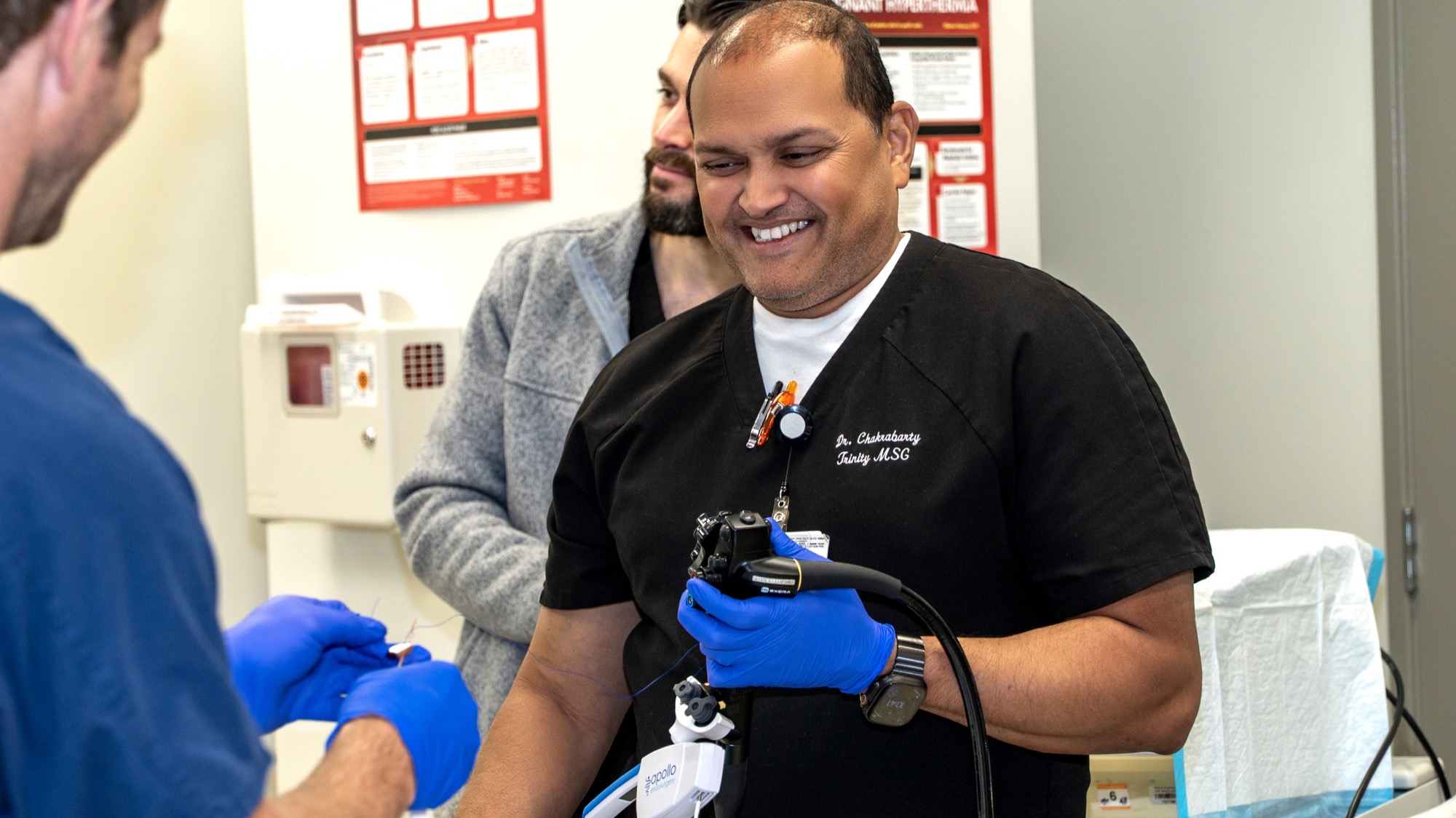 Dr. Chakrabarty smiling with the endoscope during the hands-on training session