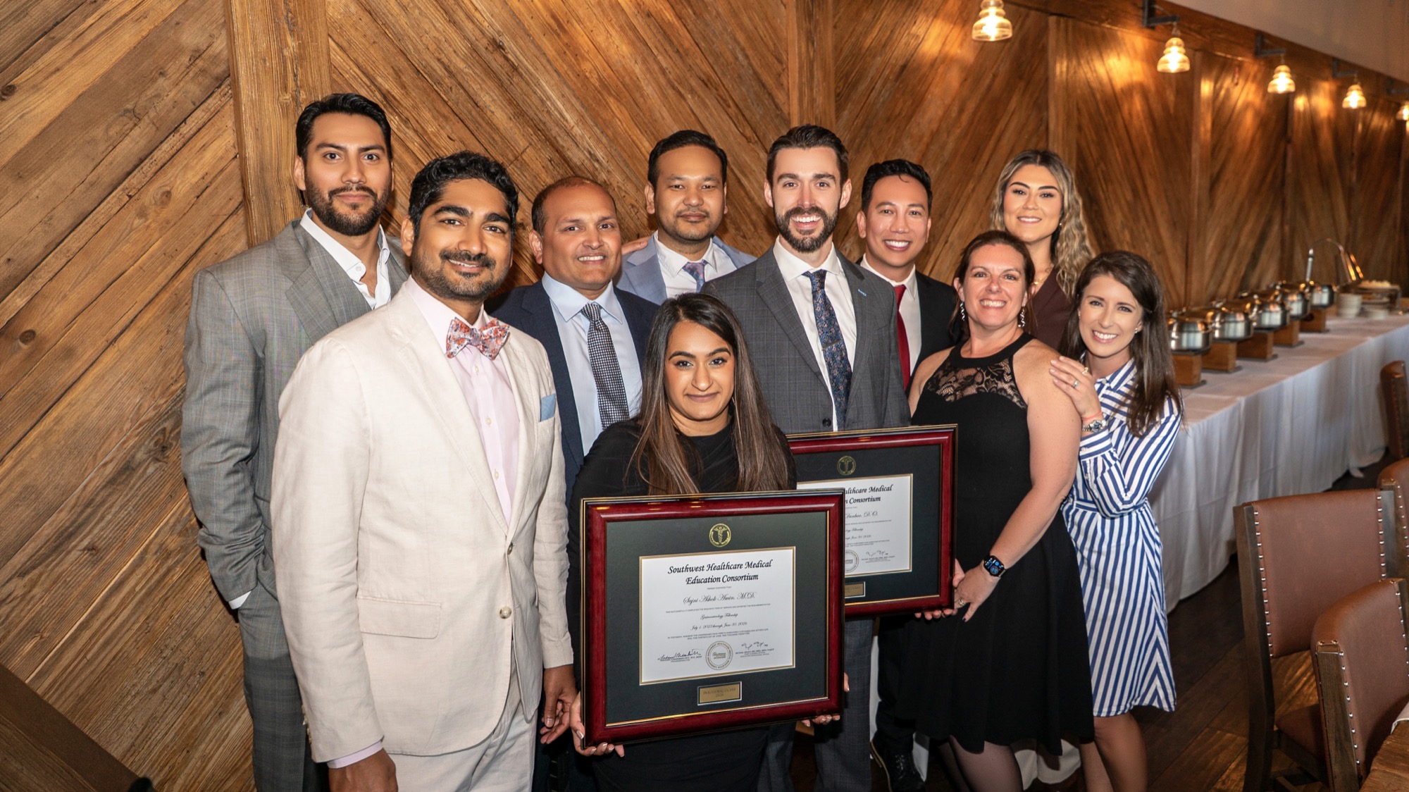 Class of 2026 fellows with mentors and Trinity MSG leadership holding certificates