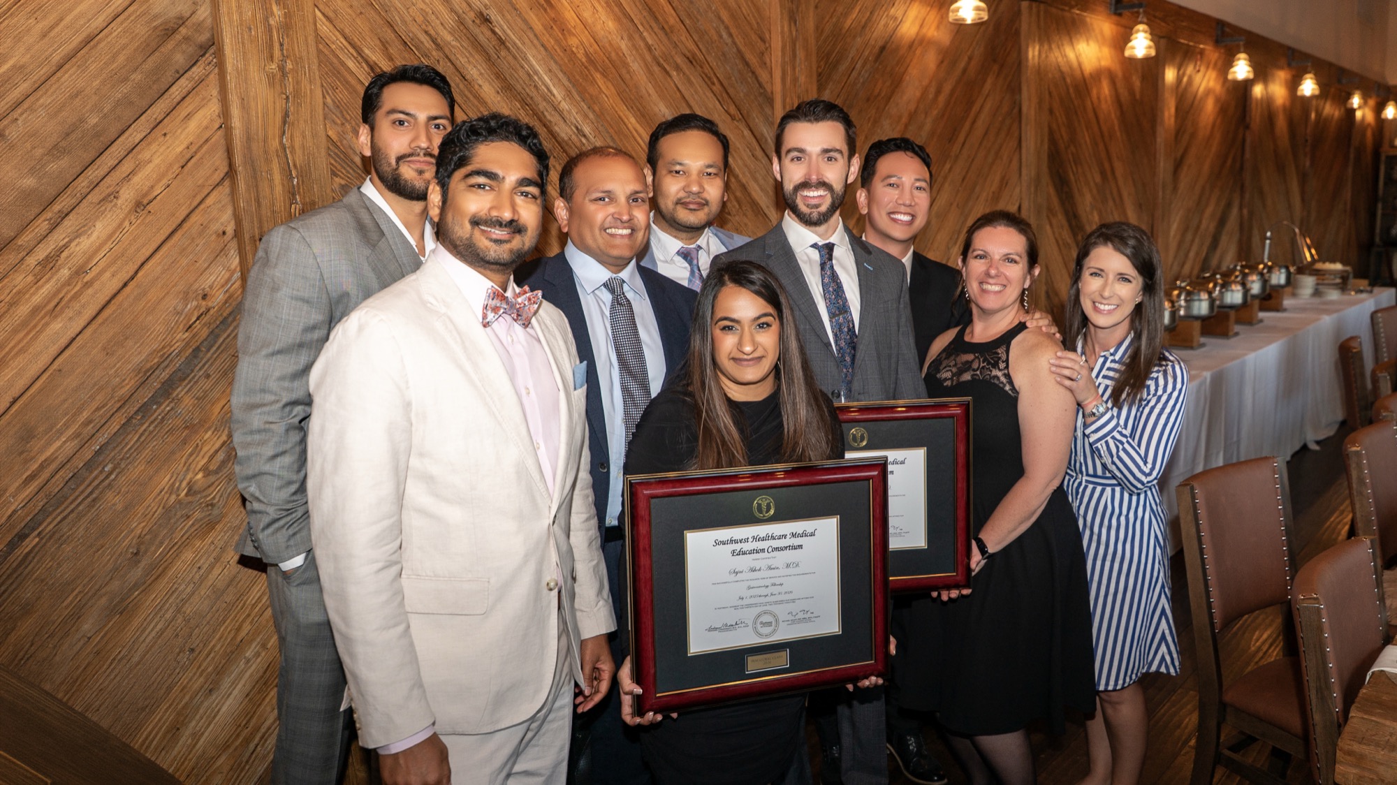 Fellows, mentors, and Trinity MSG leadership posing with certificates