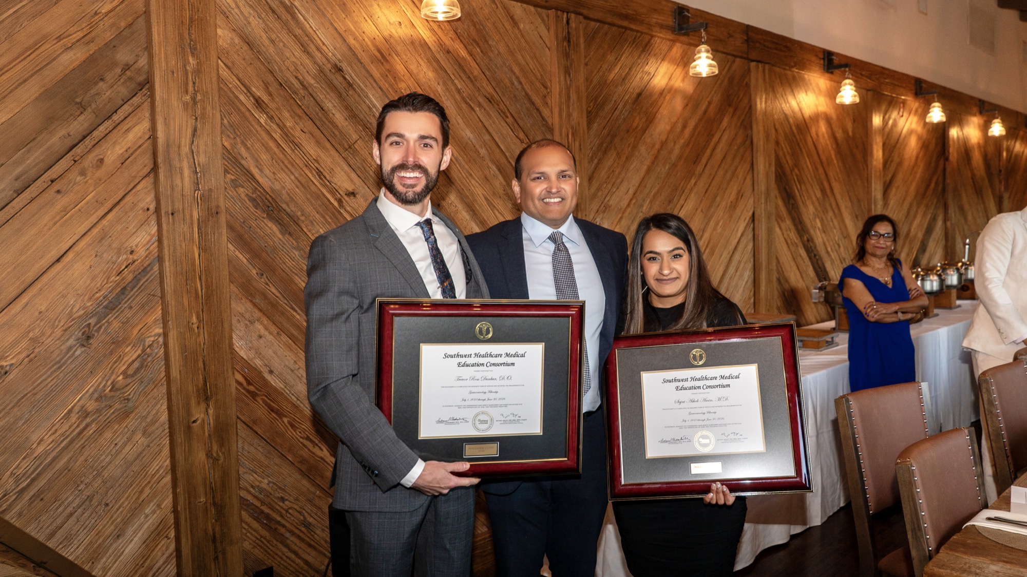 Dr. Trevor Dunbar and Dr. Sajni Amin with Dr. Veluvolu holding their fellowship certificates