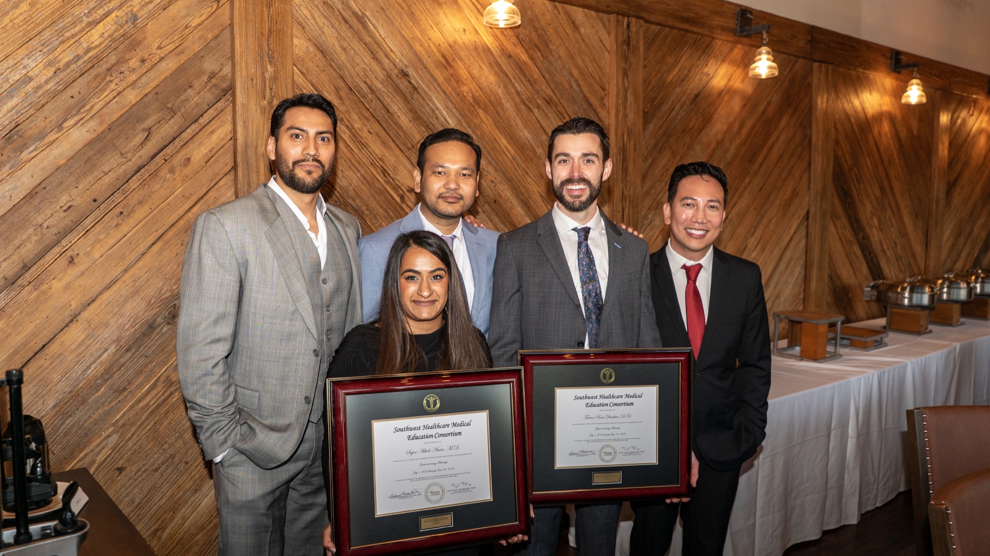 Dr. Amin and Dr. Dunbar with fellow physicians holding their certificates